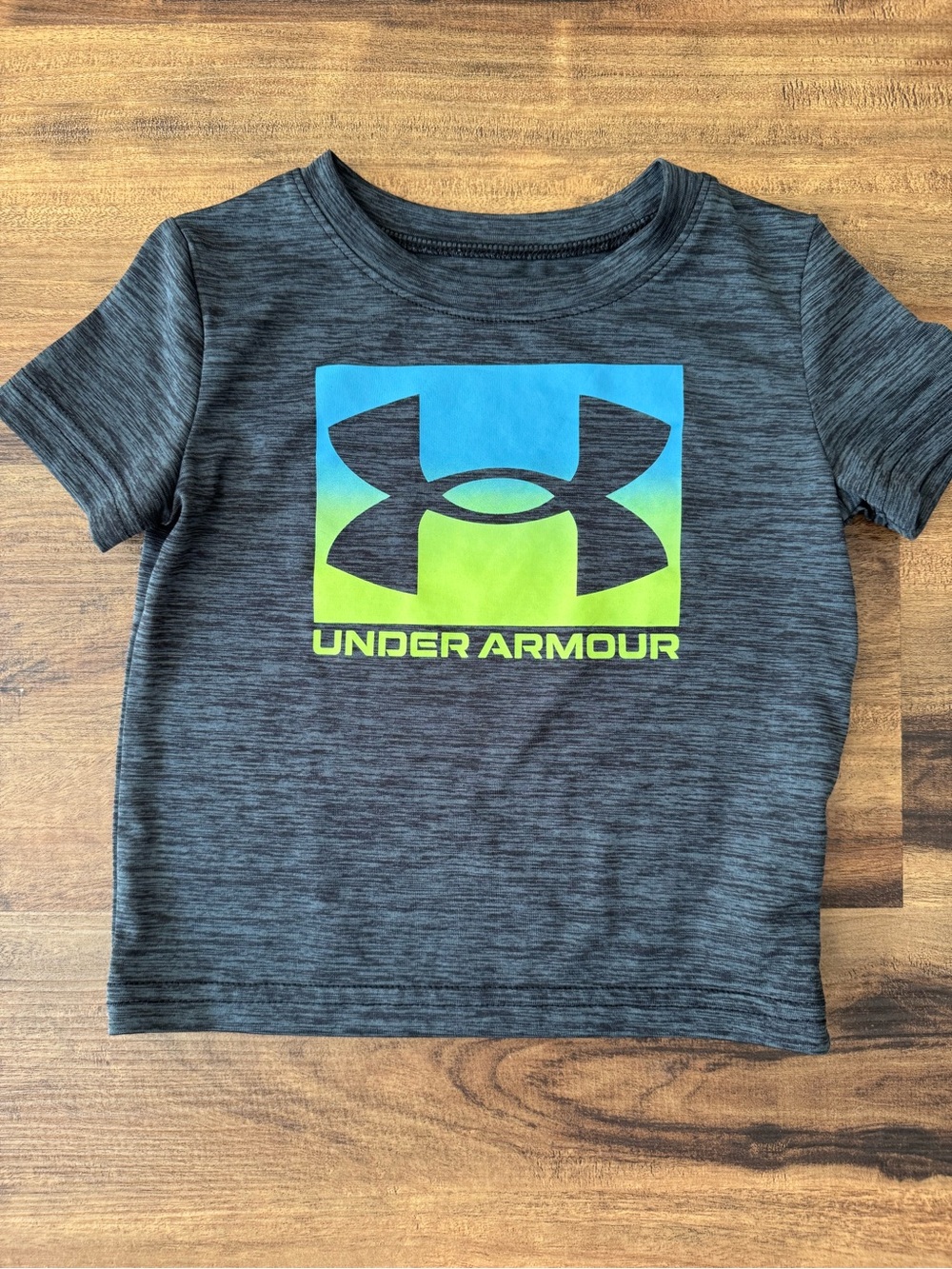 Under Armour Kids Charcoal Heather Tee with Blue and Green Logo Size 18 Mths.